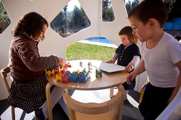 Outdoor playhouse with kids playing